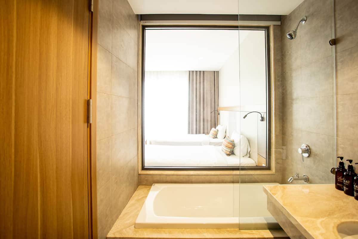 panoramic double or twin room | bathroom | designer toiletries, hair dryer, slippers, towels