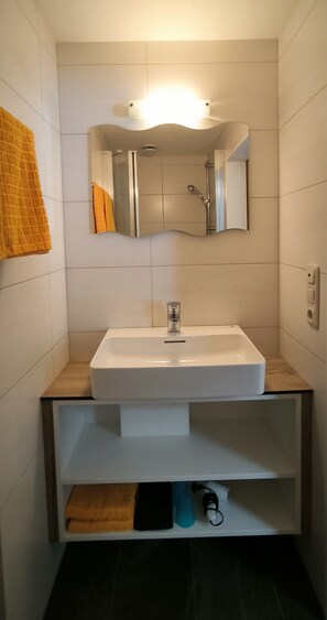 Shower, hair dryer, towels, toilet paper