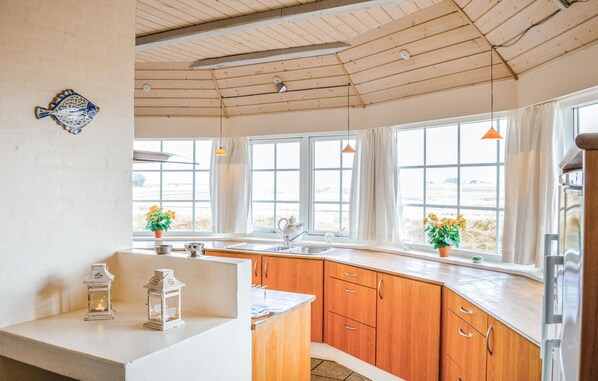 Fridge, stovetop, dishwasher, coffee/tea maker