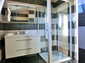 Shower, hair dryer, towels, soap