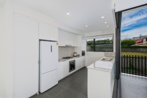 Fridge, microwave, oven, stovetop - Executive 2BR Bulimba Apartment Across from the Park on Oxford St (Bulimba)