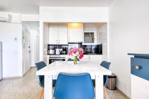 Fridge, microwave, coffee/tea maker, cookware/dishes/utensils