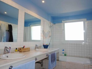 Bathtub, hair dryer, towels