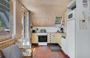 Fridge, stovetop, dishwasher, coffee/tea maker