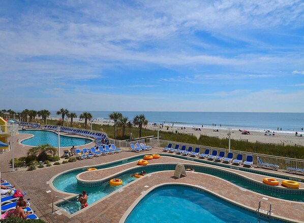 Relax by the pool or enjoy the scenic beach view.