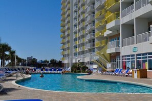 Relax by the pool surrounded by comfortable lounge chairs and take in the views from the adjacent building's balconies.