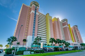 Stunning hotel with a unique architectural design, featuring vertical columns and large windows.