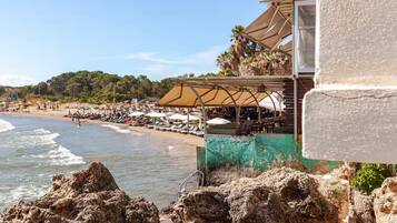 On the beach, sun-loungers, beach towels