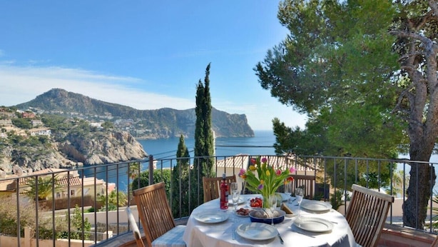 A table set for dining with a view of the sea and mountains. - Charming Villa with Sea Views & Pool (Andratx)