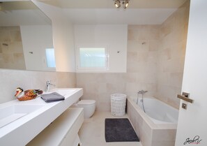 Bathtub, hair dryer, towels