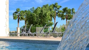 A pool area with lounge chairs and palm trees. - Son Sastre 024 luxurious villa with large swimming pool, air conditioning, garden and terrace (Muro)