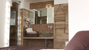 A modern bathroom with a glass shower, a wooden vanity, and a hanging towel rack. - DIMORA DIAMANTE - ZAFFIRO ROOM                                    (Napoli)