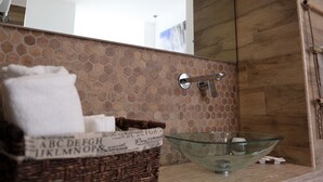A bathroom with a glass bowl sink, a wooden vanity, and a mirror above the sink. - DIMORA DIAMANTE - ZAFFIRO ROOM                                    (Napoli)