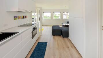 Fridge, stovetop, dishwasher, coffee/tea maker