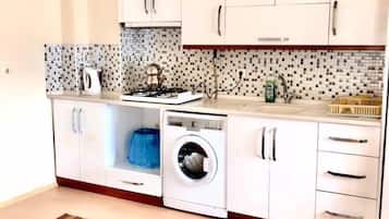 Fridge, stovetop, cookware/dishes/utensils