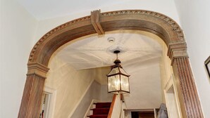 An arched doorway with a wooden frame and a hanging lantern. - Duvall House - George Washington ate here! In the heart of Old Town Alexandria.  (Alexandria)
