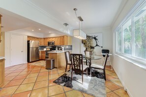 Enjoy cooking in this well-lit kitchen with a central island and stainless steel appliances.