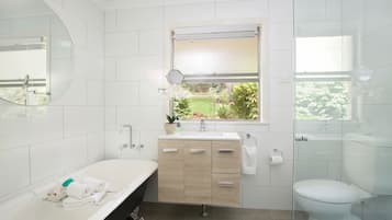 Bathtub, hair dryer, towels, soap