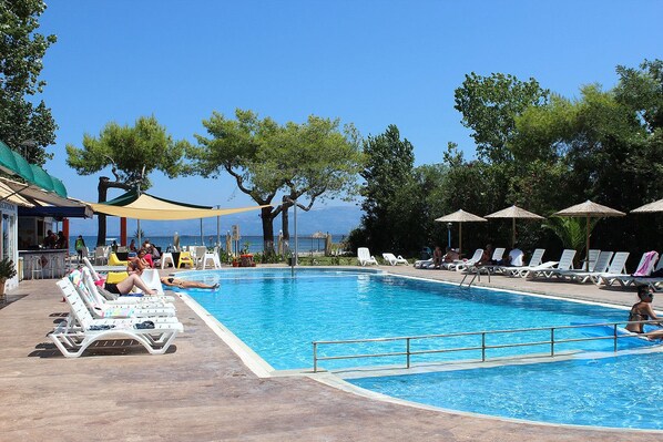 Outdoor pool, open 8:30 AM to 7 PM, pool umbrellas, pool loungers
