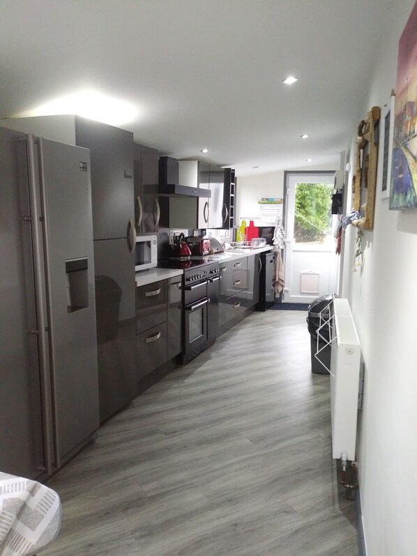 A modern kitchen with stainless steel appliances, a microwave, and a stove.