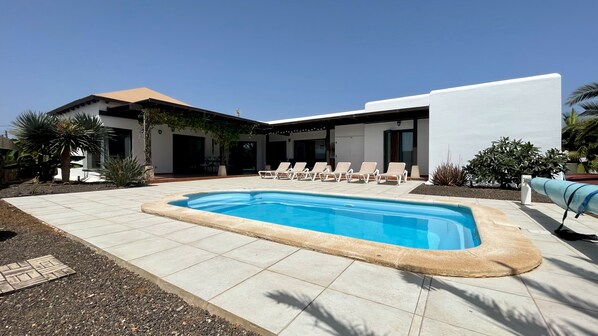Outdoor pool, a heated pool, pool loungers