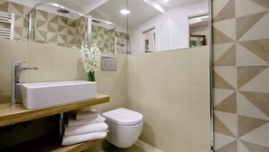 A modern bathroom with a rectangular sink, a toilet, and a shower area. - COLOSSEUM ELEGANT APARTMENT FOR 4 - NEAR METRO (Roma)