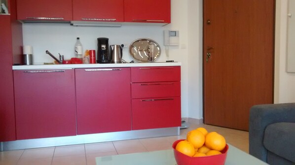 Fridge, microwave, stovetop, coffee/tea maker