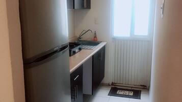 Fridge, microwave, cookware/dishes/utensils