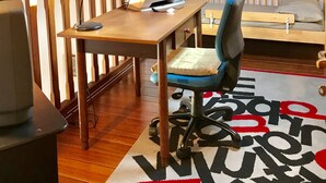 A cozy room with a wooden desk, a chair, a bed, and a ceiling with exposed beams. - Andrea's House. Cls to all amenities. (Firenze)