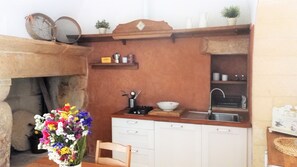 Fridge, stovetop, coffee/tea maker, cookware/dishes/utensils