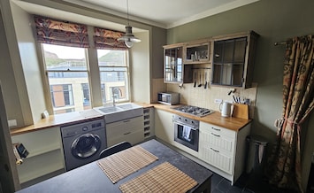 Full kitchen and dining area