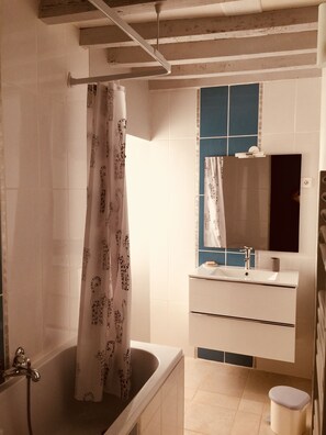 Combined shower/tub, hair dryer, towels, soap