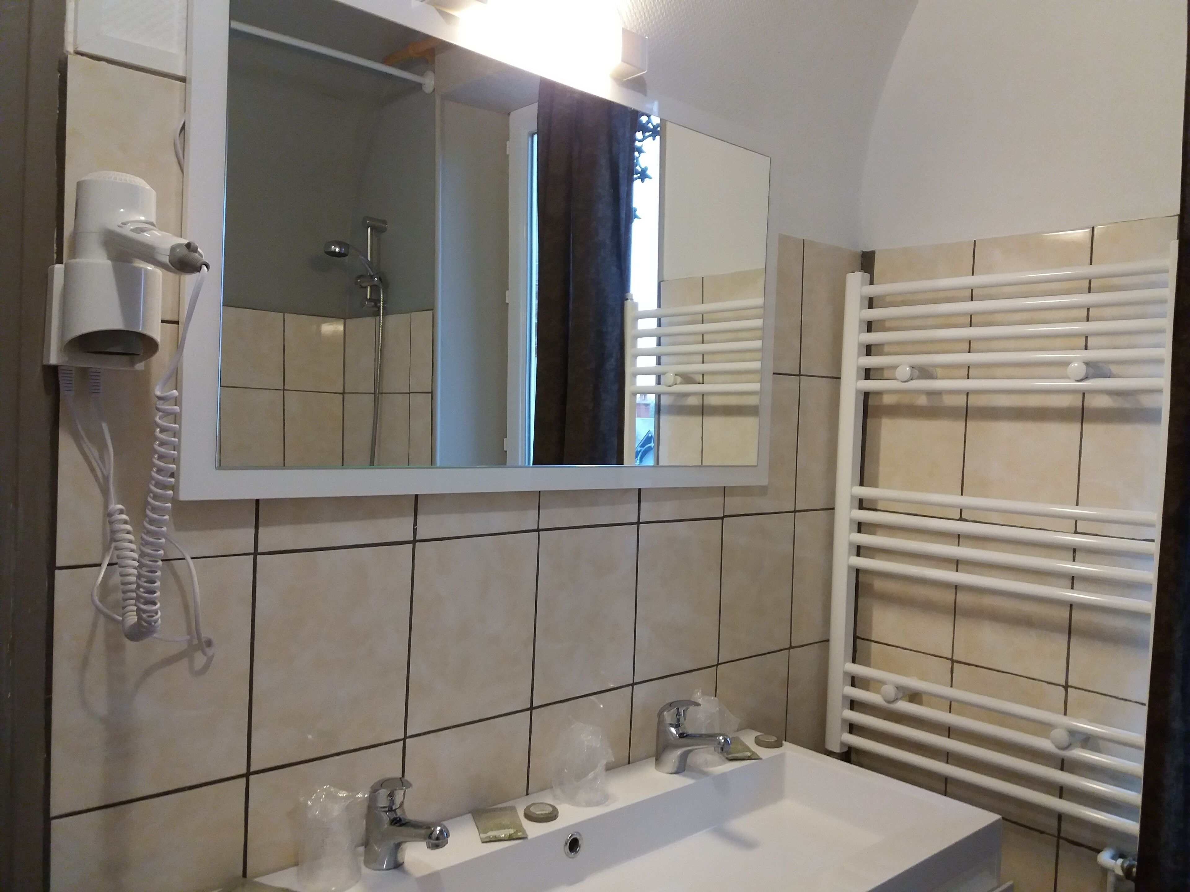Combined shower/tub, hair dryer, towels, soap