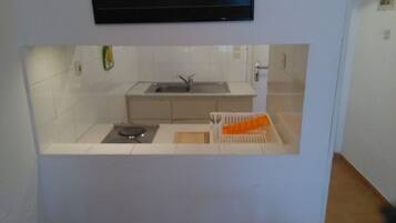 Fridge, stovetop, coffee/tea maker, cookware/dishes/utensils