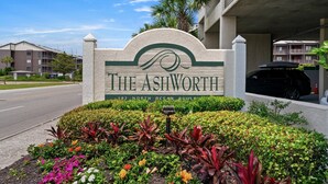 A sign for The Ashworth, a 192 North Ocean Boulevard hotel, with a landscaped garden in front. - Clean 4th Floor, AshWorth, Oceanfront, Lazy River, Pools | Ashworth - 409 (North Myrtle Beach)