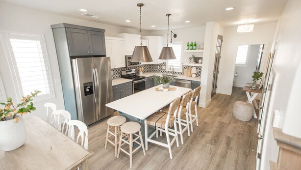 A modern kitchen with a central island, stainless steel appliances, and pendant lighting. - 💎 Blue Skies Ahead 💎- POOL IS OPEN!!! (Washington)