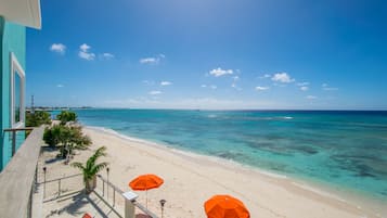 On the beach, sun-loungers, beach umbrellas, beach towels