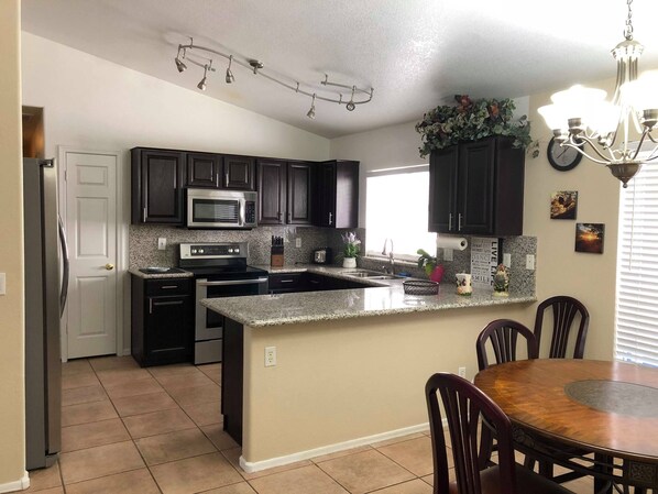 Microwave, dishwasher, coffee/tea maker, cookware/dishes/utensils