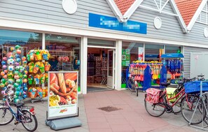 A store with colorful items like balls and buckets outside. - Amazing home in Bruinisse with kitchen (Bruinisse)