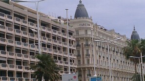 Experience the grandeur of Carlton, a classic building with a prominent dome and ornate detailing.