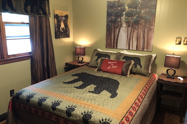 Master bedroom, queen bed, makeup table with mirror, chest of drawers and closet