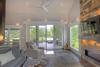 Modern home on creek and golf course with mountain views; ideal 2 families