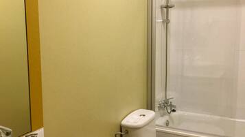 A bathroom with a sink, toilet, and shower.