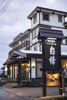 A building with a sign that reads "SHICHAOHEI COFFEE" and Japanese characters above it.