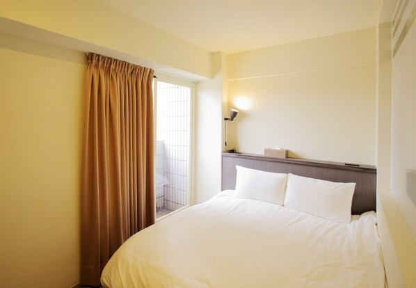 Kahden hengen standard-huone | Kannettavalle tietokoneelle sopiva työtila, pimennysverhot, äänieristys