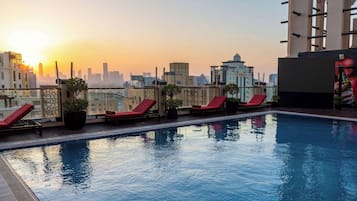 Outdoor pool, open 6:00 AM to 10:00 PM, pool umbrellas, sun loungers