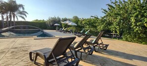 Seasonal outdoor pool, pool umbrellas, sun loungers
