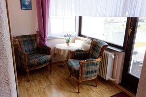 Double Room, Balcony, River View | Living area | Flat-screen TV