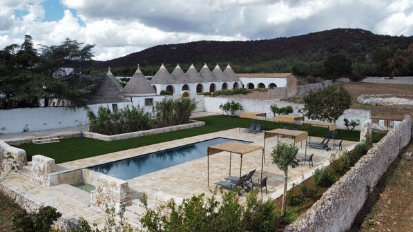 Outdoor pool, open 9:00 AM to 8:00 PM, pool umbrellas, pool loungers