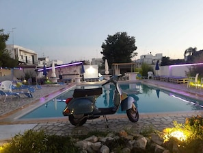 Seasonal outdoor pool, pool umbrellas, pool loungers